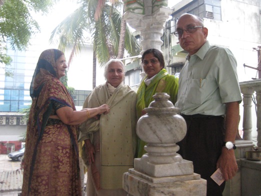 Diwali being felicitated with a shawl by her younger sister-in-law (left),flanked with her third daughter-in-law (right) and eldest son (extreme right).